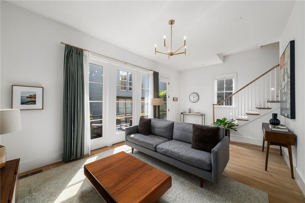 699 Eustace Street Southeast Atlanta, GA 30315 - Photo 18 of 53 a living room with furniture ceiling fan and a rug