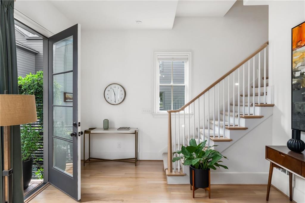 699 Eustace Street Southeast Atlanta, GA 30315 - Photo 21 of 53 a living room with wooden floor and a potted plant