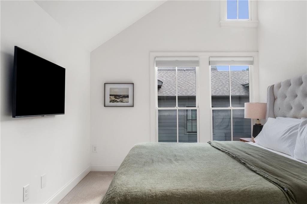 699 Eustace Street Southeast Atlanta, GA 30315 - Photo 23 of 53 a bedroom with a bed and a flat screen tv