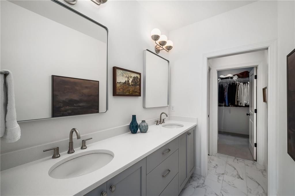 699 Eustace Street Southeast Atlanta, GA 30315 - Photo 28 of 53 a bathroom with double sink and a mirror