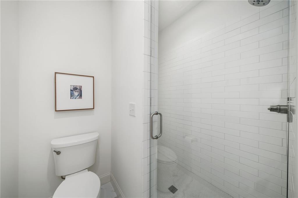 699 Eustace Street Southeast Atlanta, GA 30315 - Photo 29 of 53 a white toilet sitting next to a bathroom