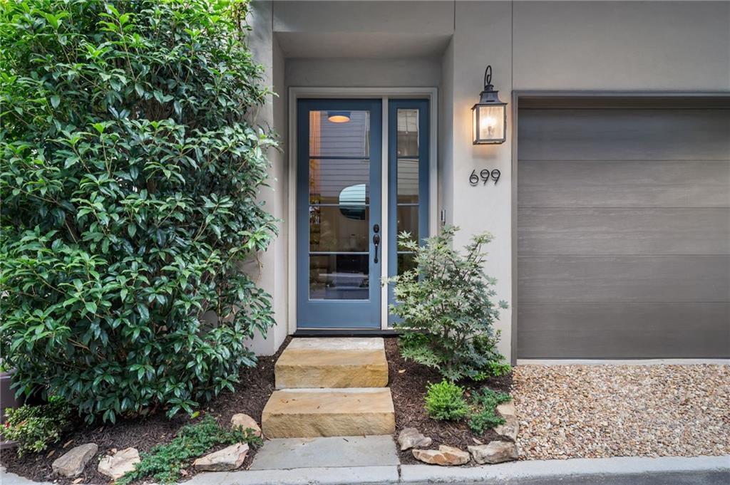 699 Eustace Street Southeast Atlanta, GA 30315 - Photo 3 of 53 a view of a entryway door with potted plants in front of door