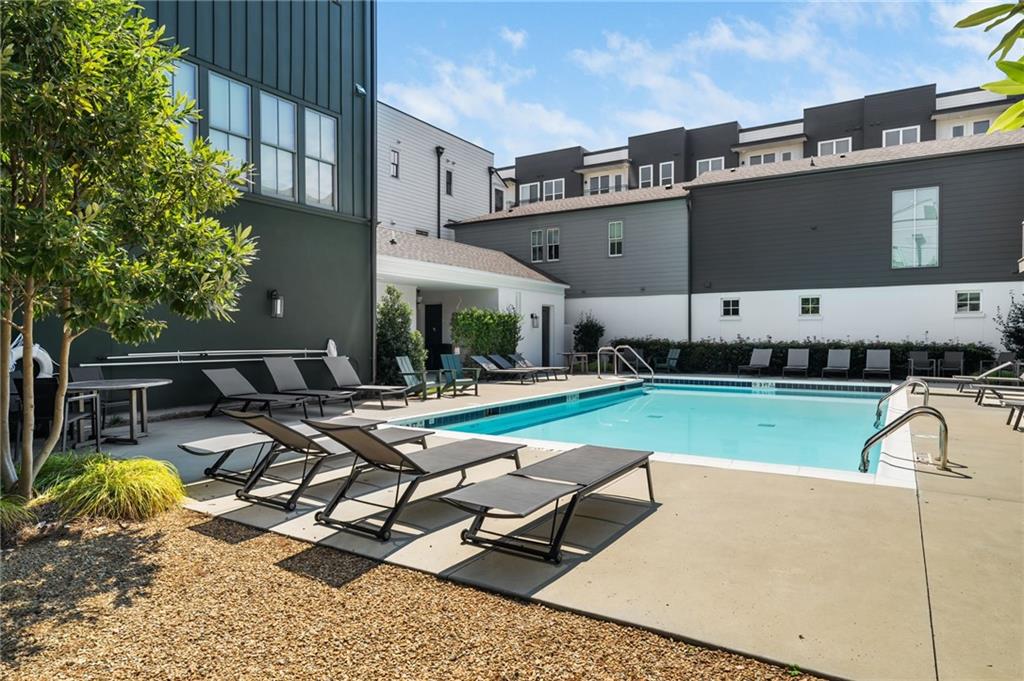 699 Eustace Street Southeast Atlanta, GA 30315 - Photo 49 of 53 a view of a swimming pool with a lounge chair