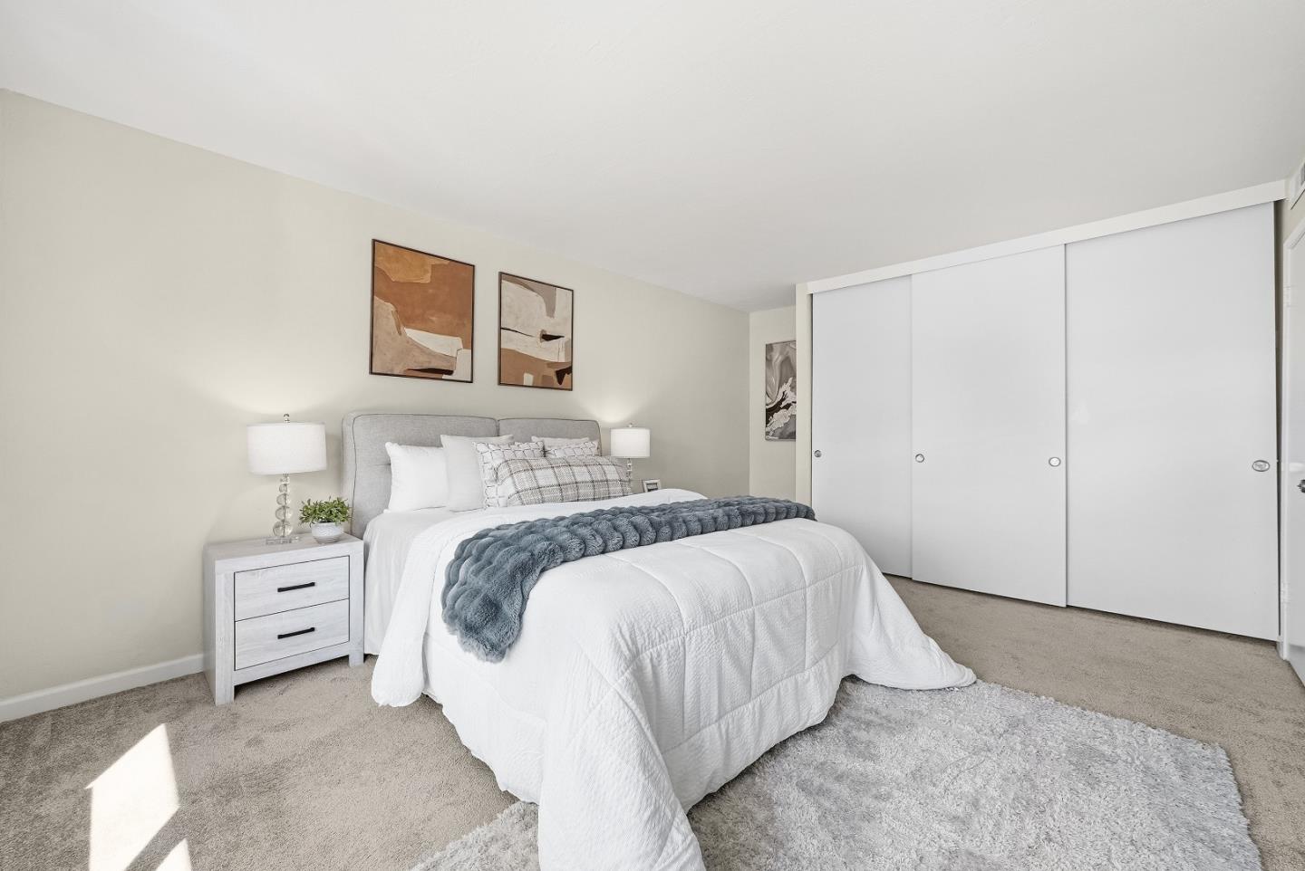 701 North Rengstorff Avenue, Unit 7 Mountain View, CA 94043 - Photo 19 of 32 a bedroom with a bed and a cabinets