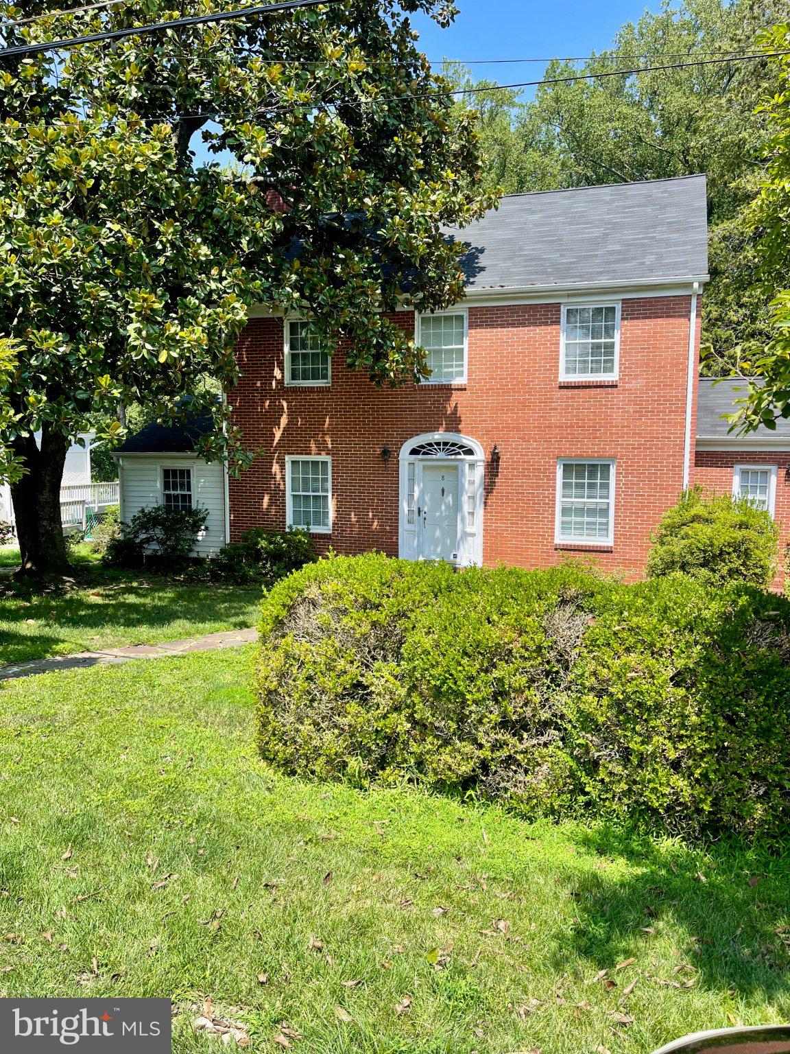 8 Brice Road Annapolis, MD 21409 - Photo 1 of 1 Charming brick home with lush greenery.