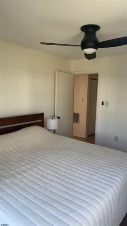 a large white bed in a white room