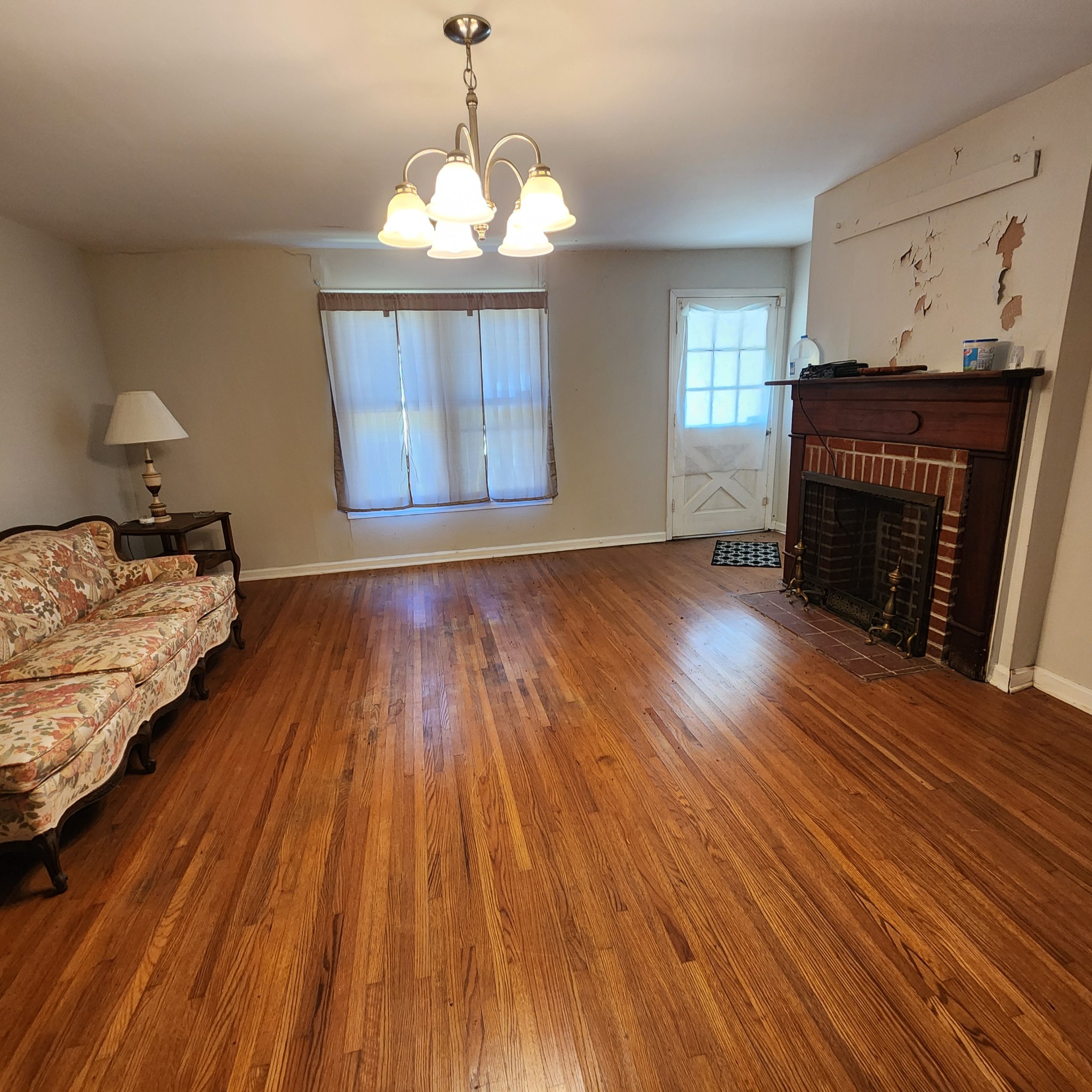 229 Bob Walker Road Bumpus Mills, TN 37028 - Photo 8 of 8 a bedroom with bed and wooden floor