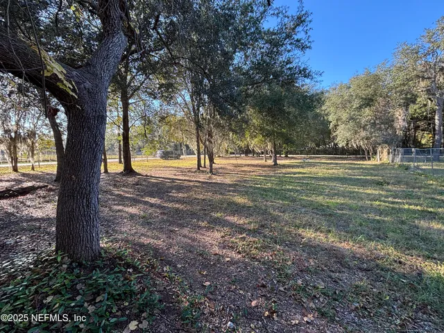 a backyard of a house with lots of green space