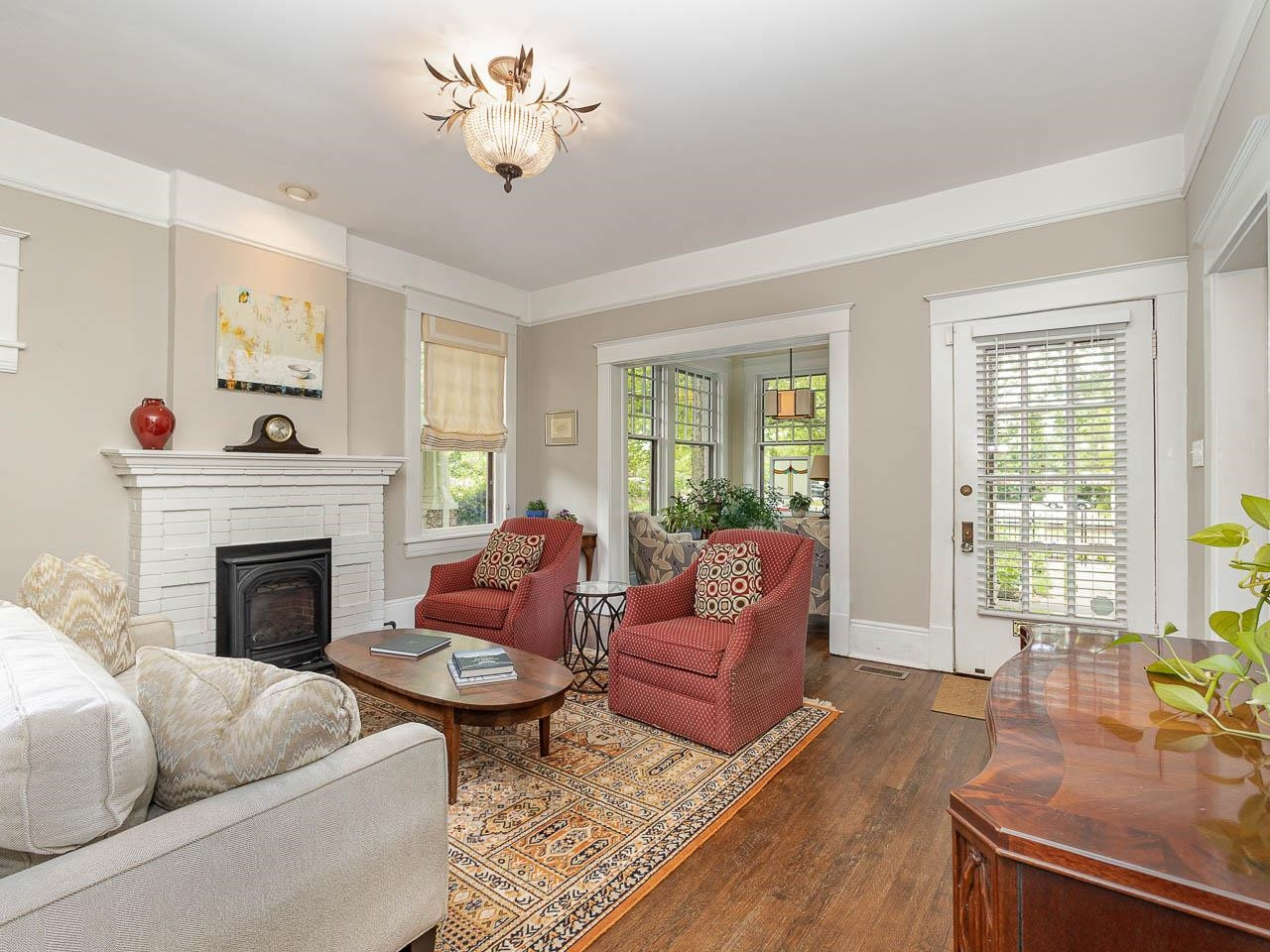 401 West Whitaker Mill Road Raleigh, NC 27608 - Photo 11 of 30 a living room with furniture a fireplace and a potted plant