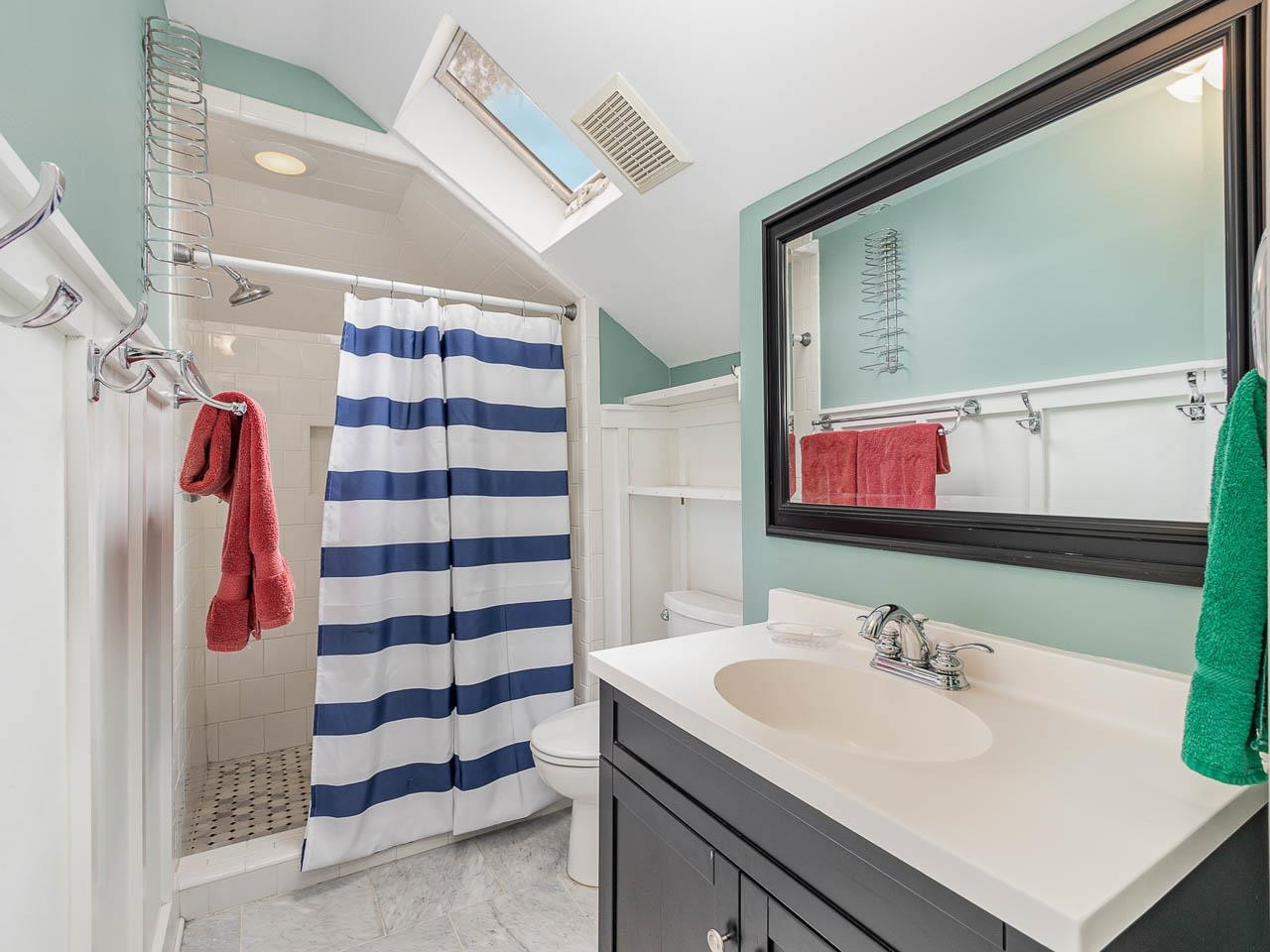 401 West Whitaker Mill Road Raleigh, NC 27608 - Photo 18 of 30 a bathroom with a sink and a mirror