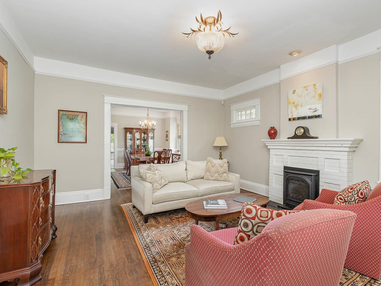 401 West Whitaker Mill Road Raleigh, NC 27608 - Photo 10 of 30 a living room with furniture a fireplace and a window