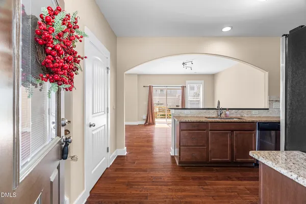 a view of a hallway kitchen and dining room