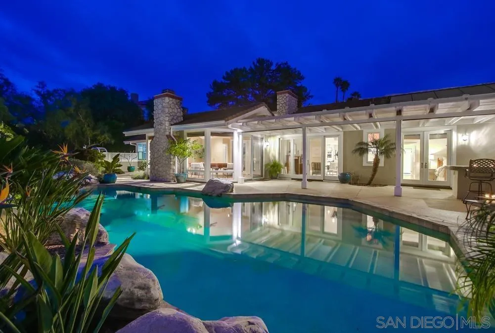16157 Country Day Road Poway, CA 92064 - Photo 2 of 70 a view of a swimming pool with a house in the background