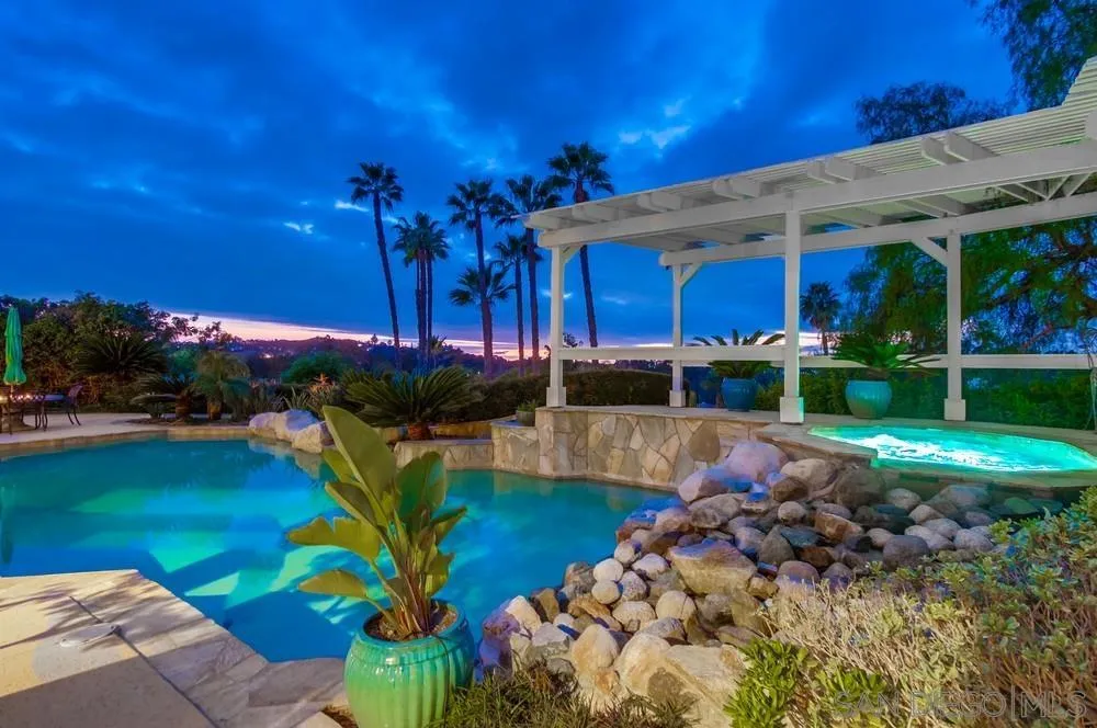 16157 Country Day Road Poway, CA 92064 - Photo 23 of 70 a view of a swimming pool with a patio