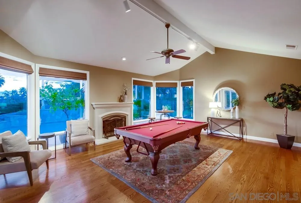 16157 Country Day Road Poway, CA 92064 - Photo 29 of 70 a living room with furniture a fireplace and large windows
