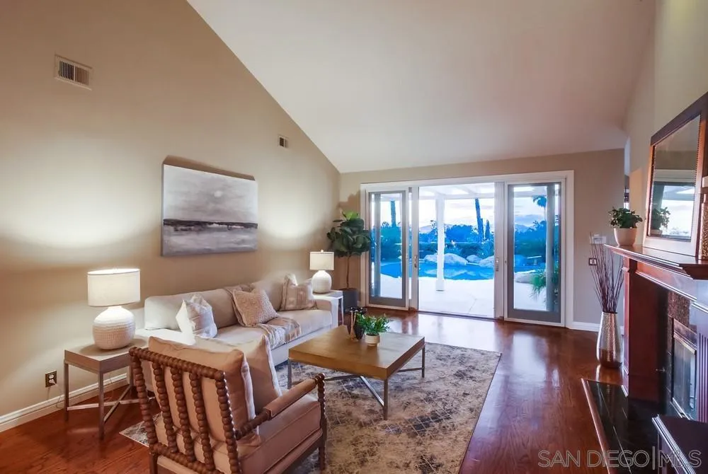 16157 Country Day Road Poway, CA 92064 - Photo 32 of 70 a living room with furniture and a fireplace