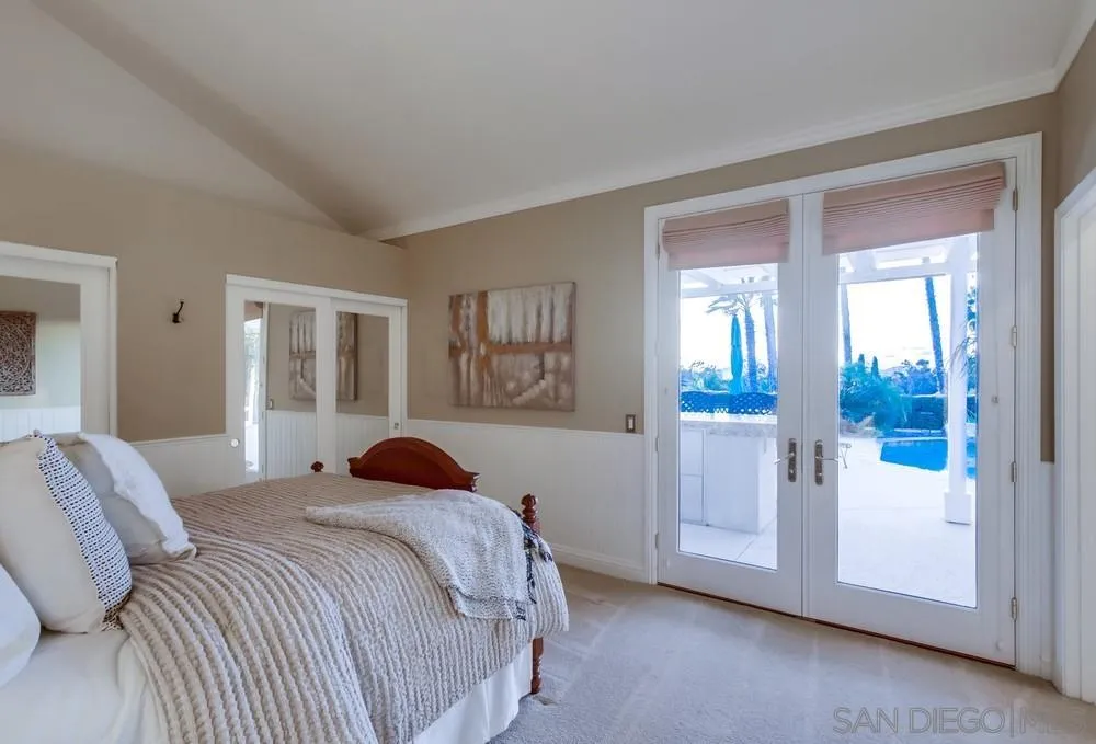 16157 Country Day Road Poway, CA 92064 - Photo 51 of 70 a bedroom with a bed and a painting on the wall