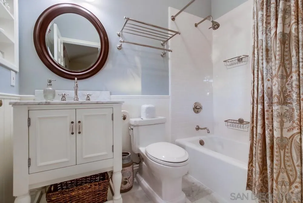 16157 Country Day Road Poway, CA 92064 - Photo 52 of 70 a bathroom with a toilet a sink and a mirror