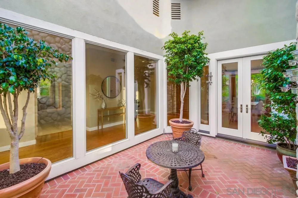 16157 Country Day Road Poway, CA 92064 - Photo 55 of 70 a living room with furniture and a potted plant