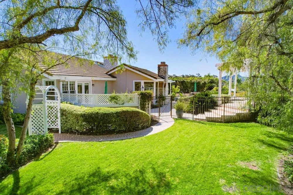 16157 Country Day Road Poway, CA 92064 - Photo 8 of 70 a view of a house with a garden and swimming pool