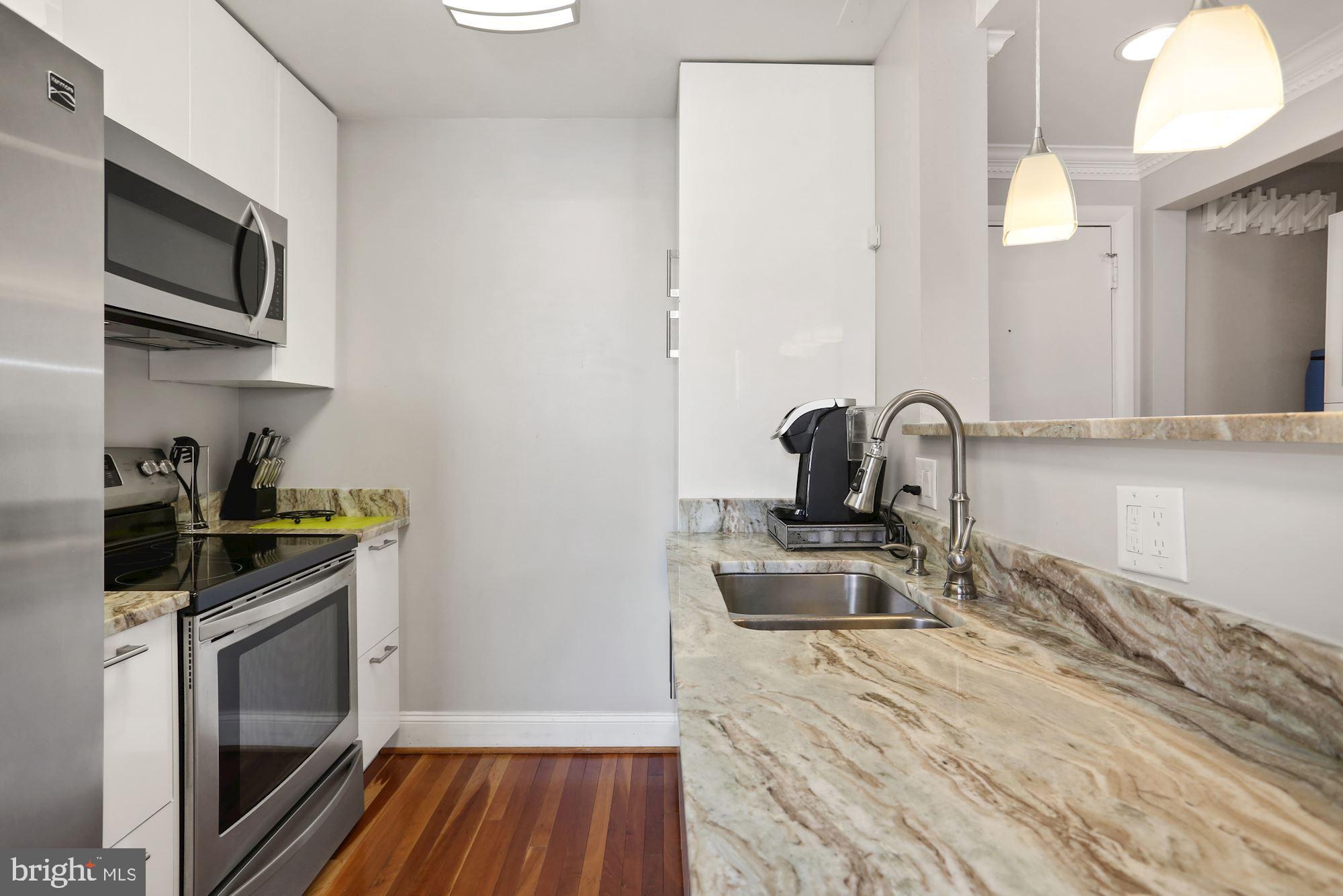 1763 Columbia Road Northwest, Unit 509 Washington, DC 20009 - Photo 11 of 39 Galley Kitchen with Granite Counter top