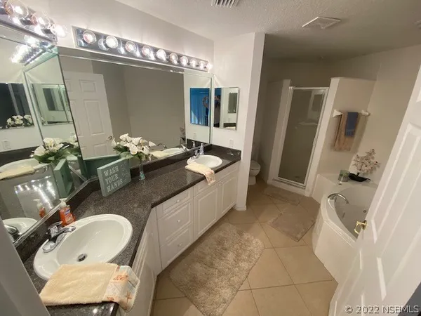 a bath room with sink and mirror