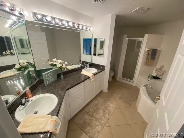 a bath room with sink and mirror