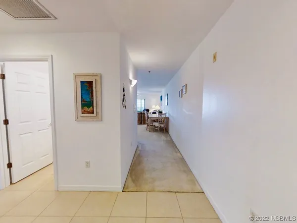 a view of a hallway view with living room