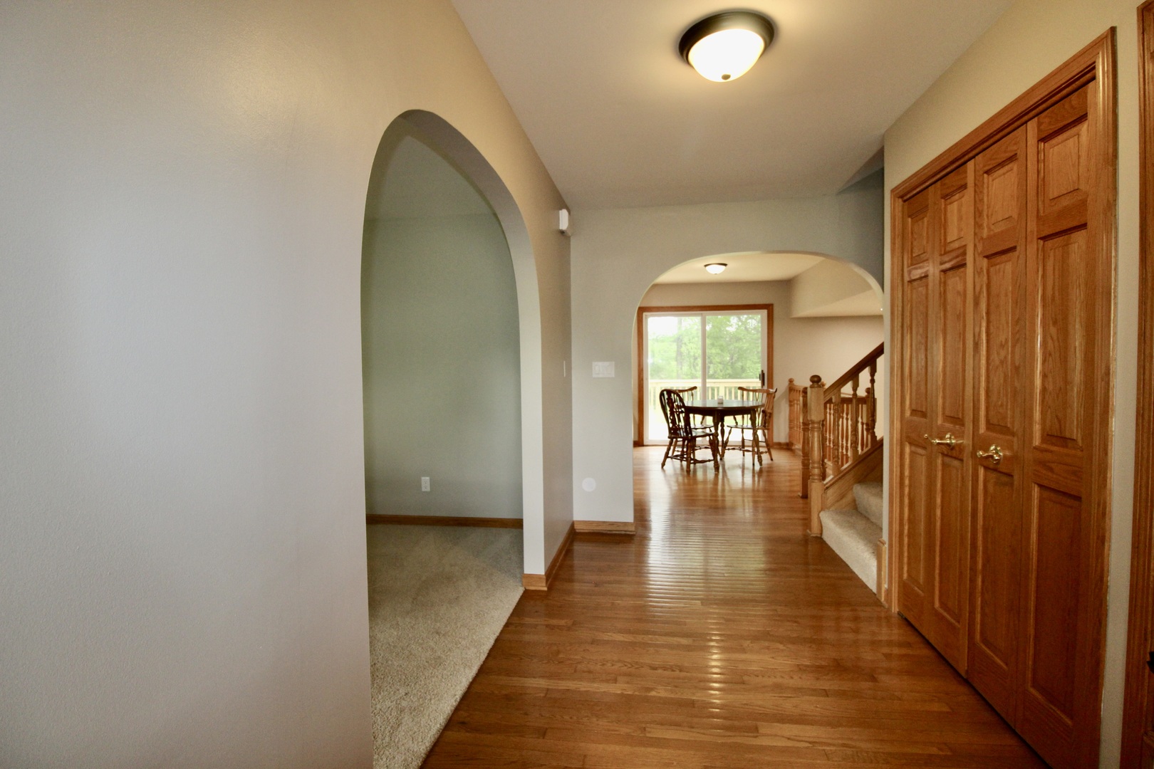 1505 Pheasant Run Road Harvard, IL 60033 - Photo 14 of 30 a view of a hallway view with wooden floor and staircase
