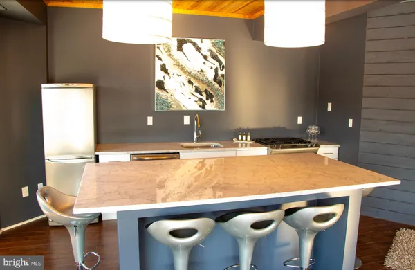 a room with two separate beds and large windows