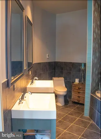 a bathroom with a sink and a shower