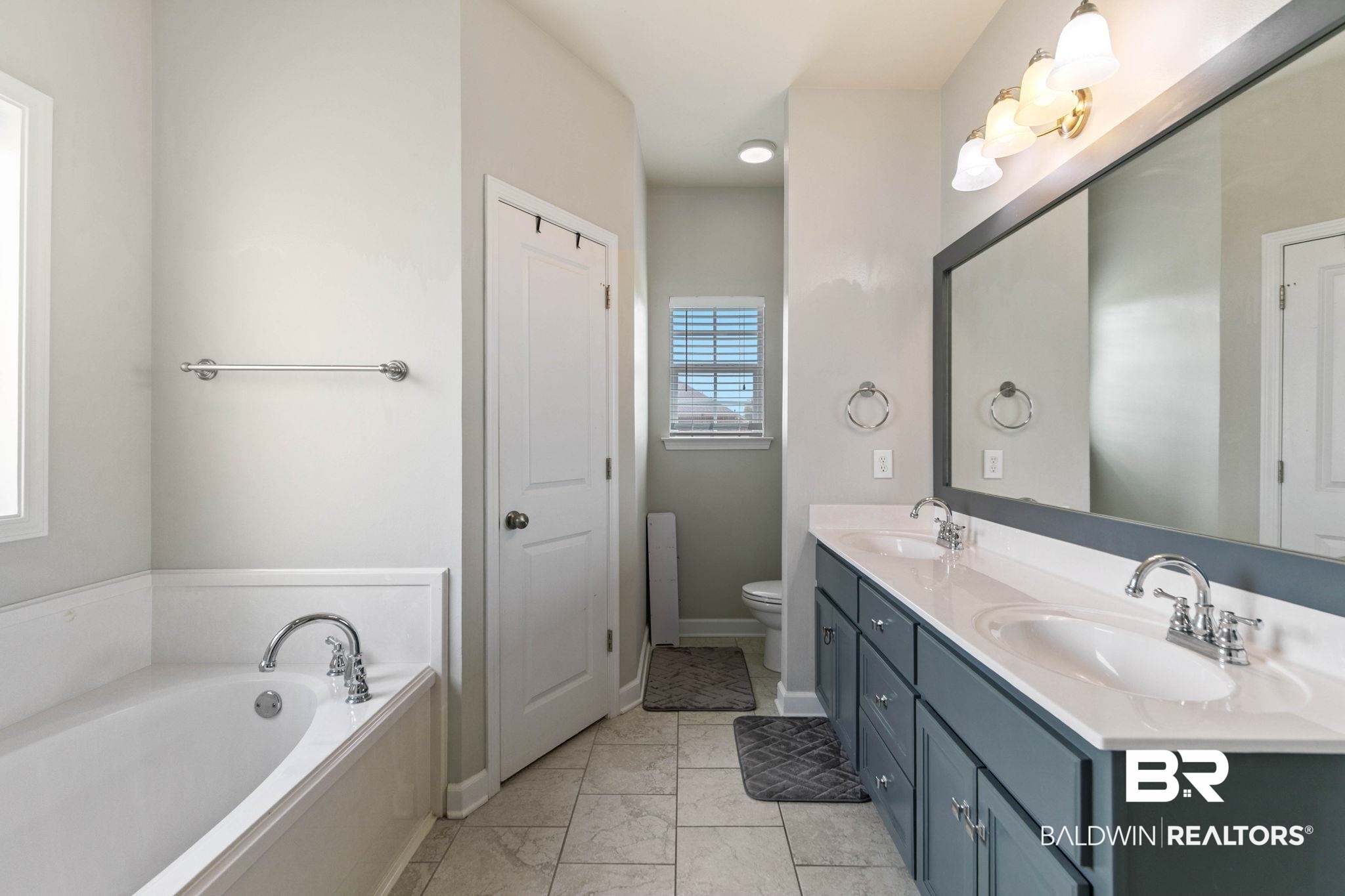 9177 Labrador Trail Theodore, AL 36582 - Photo 18 of 24 Full bathroom featuring double vanity and a bath