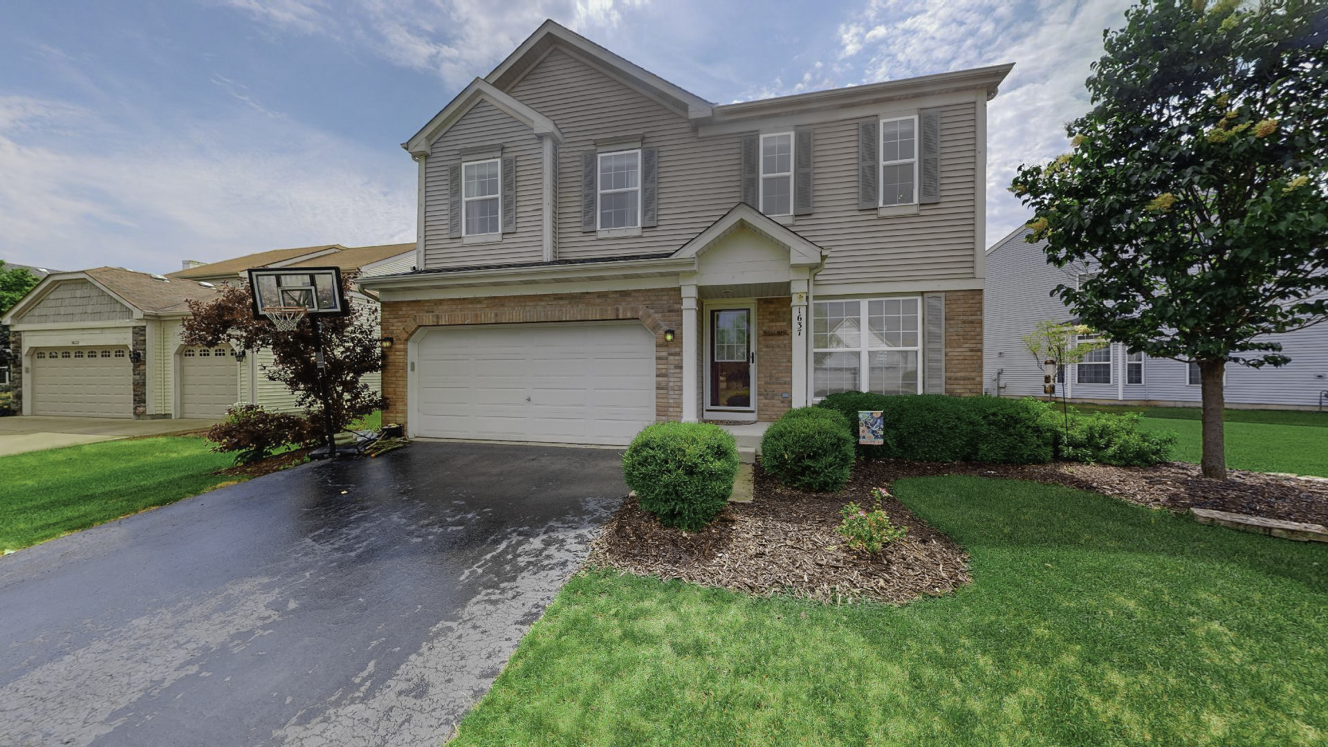 1637 Trails End Lane Bolingbrook, IL 60490 - Photo 1 of 40 a front view of a house with a yard and garage