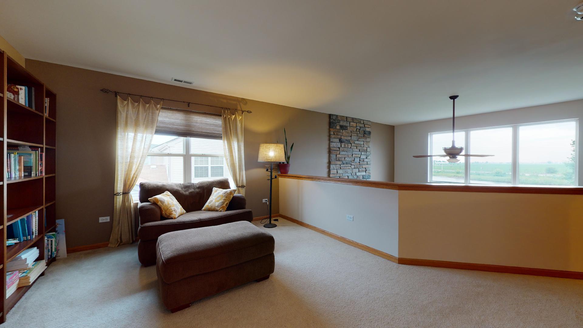 1637 Trails End Lane Bolingbrook, IL 60490 - Photo 12 of 40 a living room with furniture and a large window