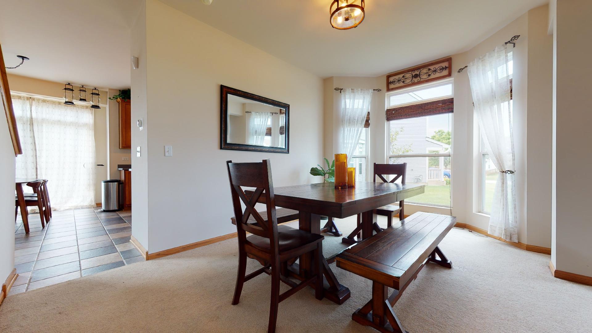 1637 Trails End Lane Bolingbrook, IL 60490 - Photo 14 of 40 a view of a dining room with furniture