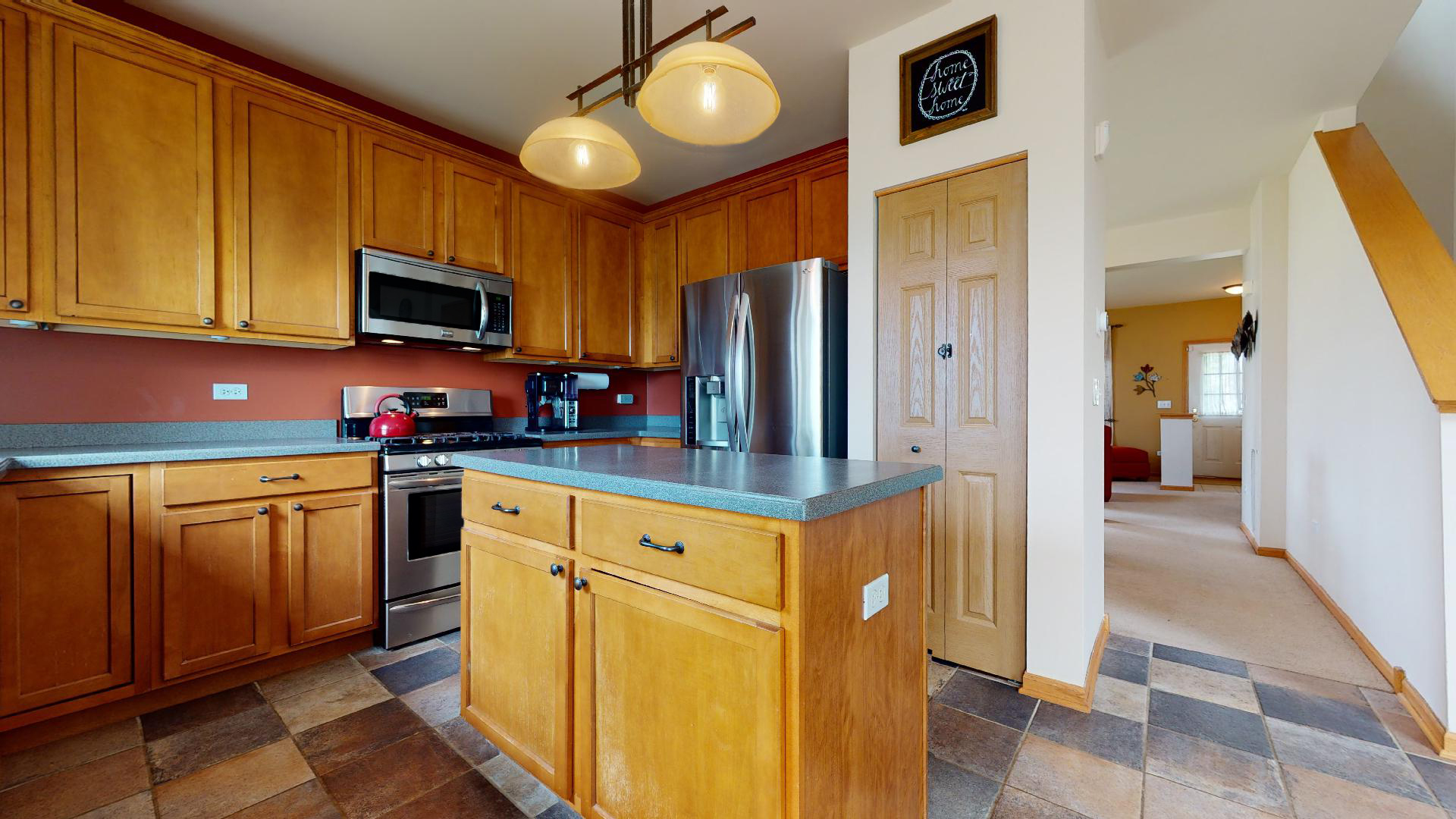 1637 Trails End Lane Bolingbrook, IL 60490 - Photo 17 of 40 a kitchen with stainless steel appliances granite countertop a refrigerator a stove top oven a sink and dishwasher