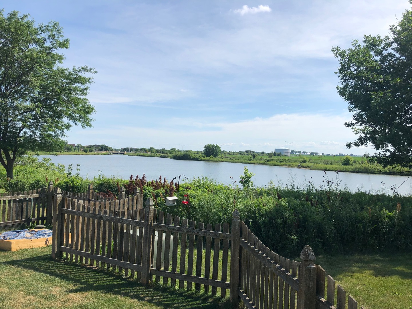1637 Trails End Lane Bolingbrook, IL 60490 - Photo 23 of 40 a view of a lake from a balcony with outdoor space