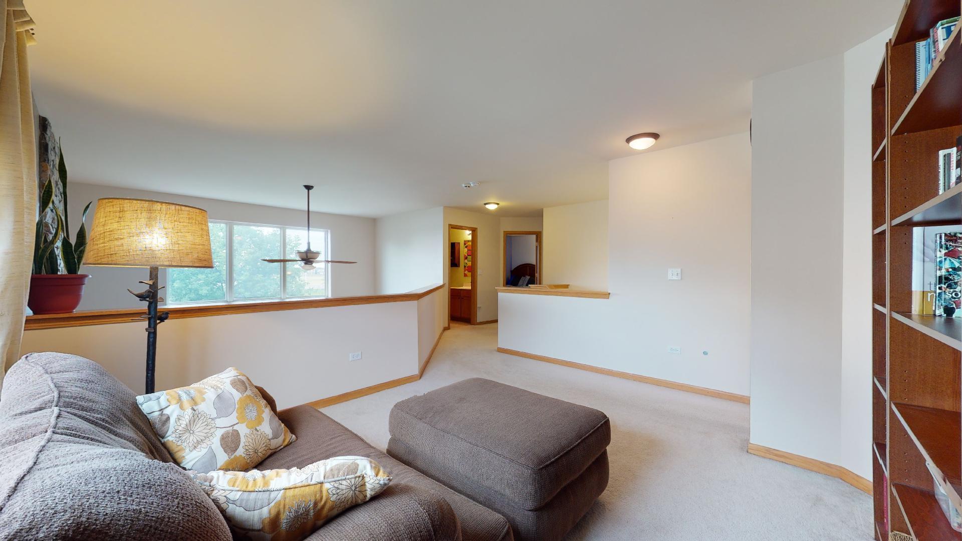 1637 Trails End Lane Bolingbrook, IL 60490 - Photo 30 of 40 a living room with furniture and a lamp