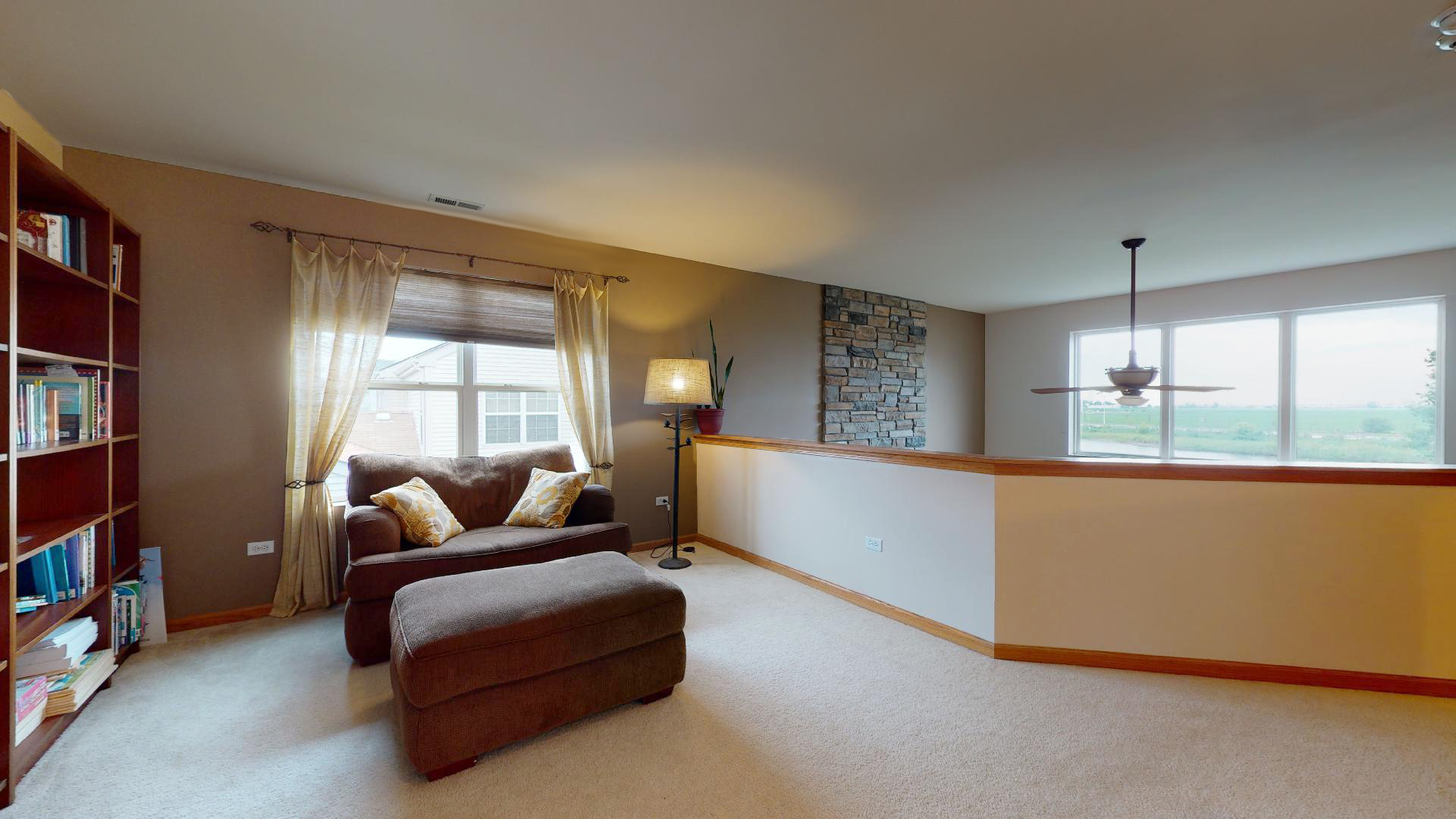 1637 Trails End Lane Bolingbrook, IL 60490 - Photo 33 of 40 a living room with furniture and a large window