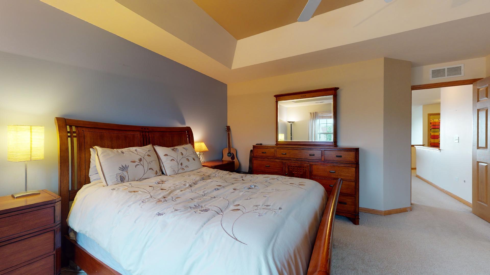 1637 Trails End Lane Bolingbrook, IL 60490 - Photo 34 of 40 a bedroom with a bed and a lamp on dresser
