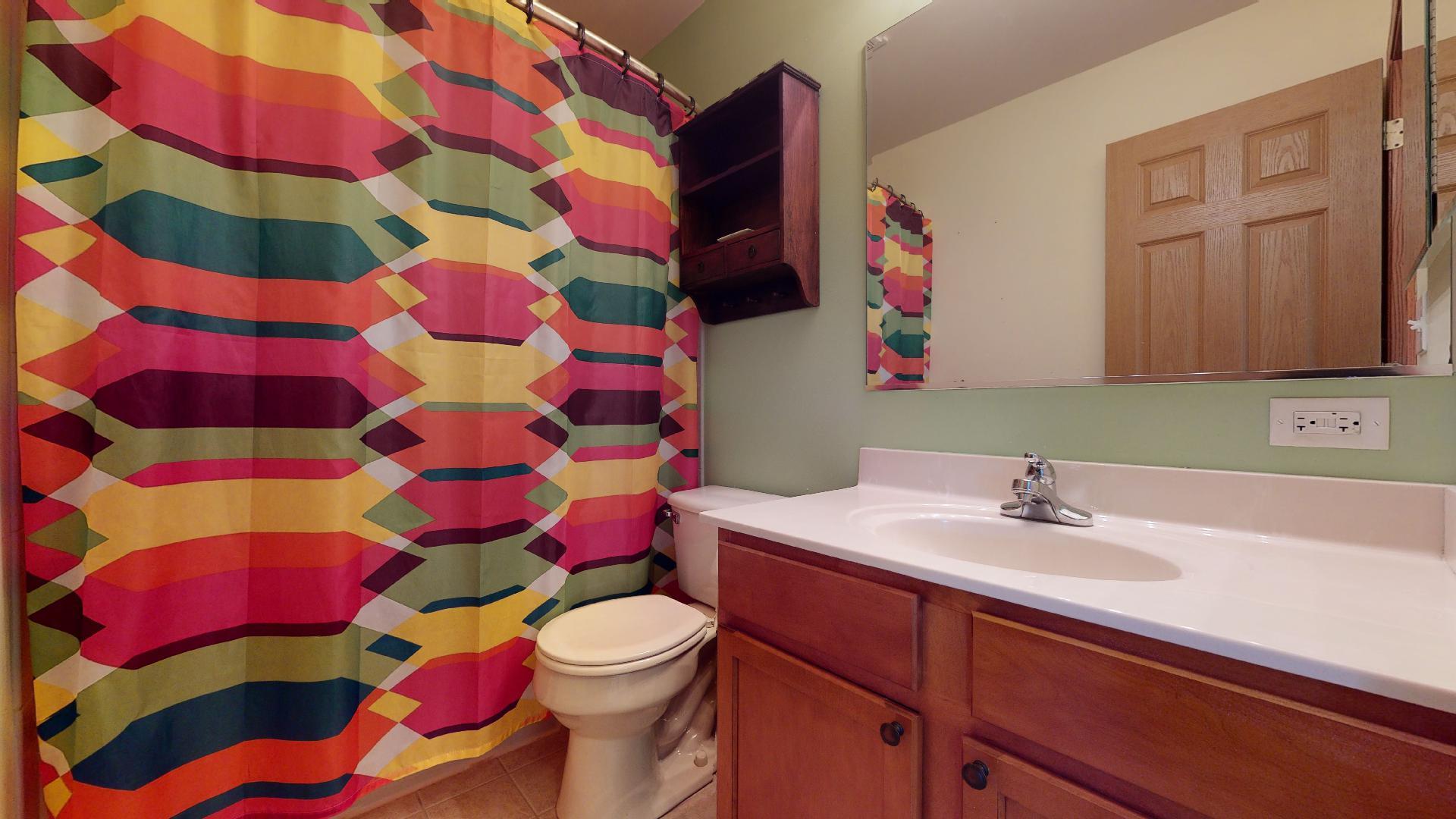 1637 Trails End Lane Bolingbrook, IL 60490 - Photo 6 of 40 a bathroom with a sink toilet and shower