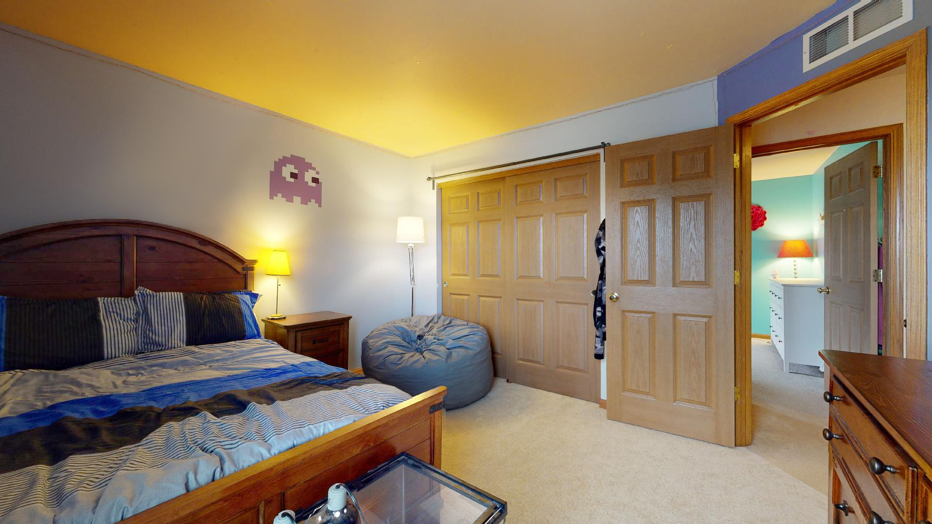 1637 Trails End Lane Bolingbrook, IL 60490 - Photo 9 of 40 a bedroom with a bed a dresser and a painting
