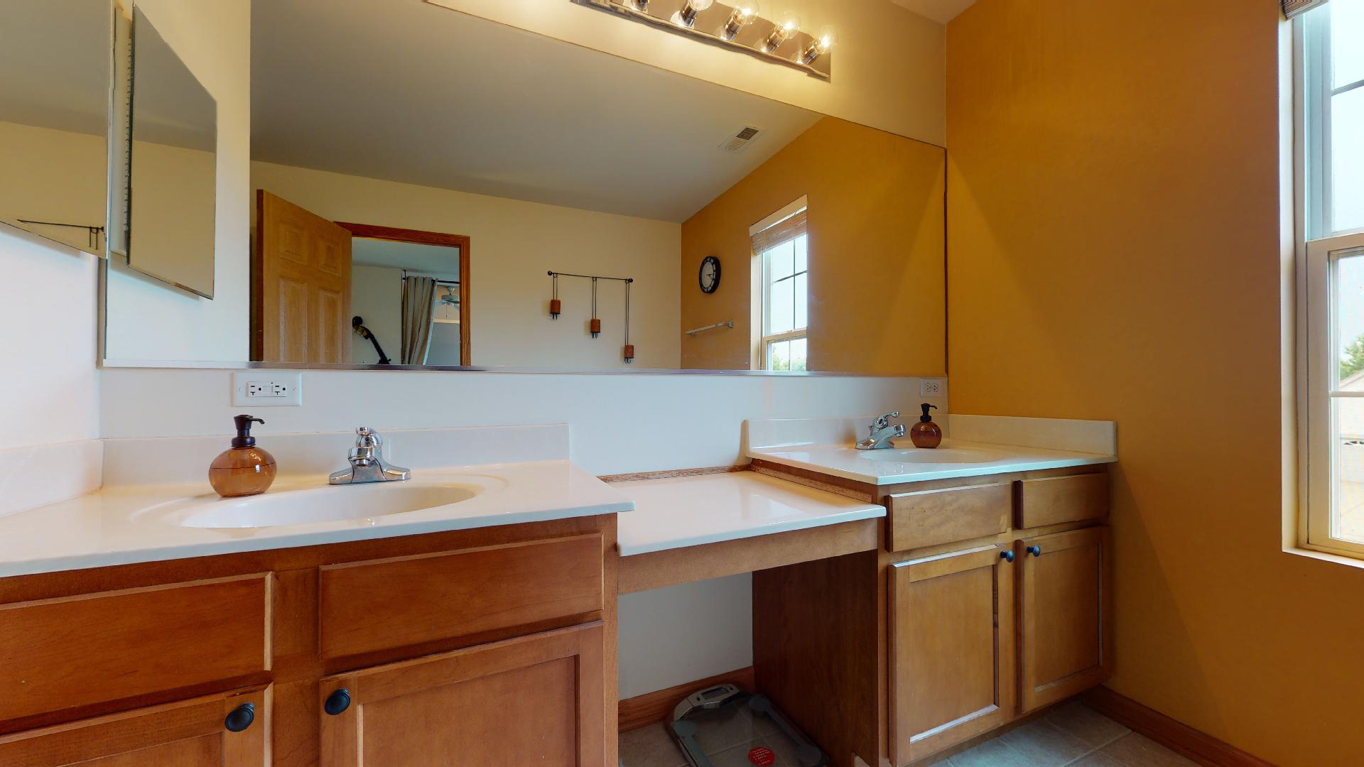 1637 Trails End Lane Bolingbrook, IL 60490 - Photo 10 of 40 a view of a sink and a refrigerator in a bathroom