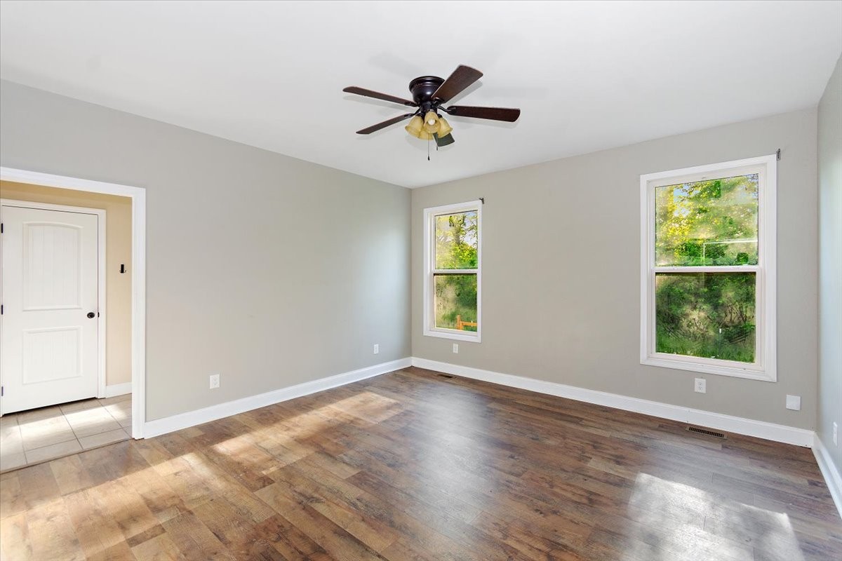 118 East Biggs Road Portland, TN 37148 - Photo 15 of 26 a view of a livingroom with a window and a ceiling fan