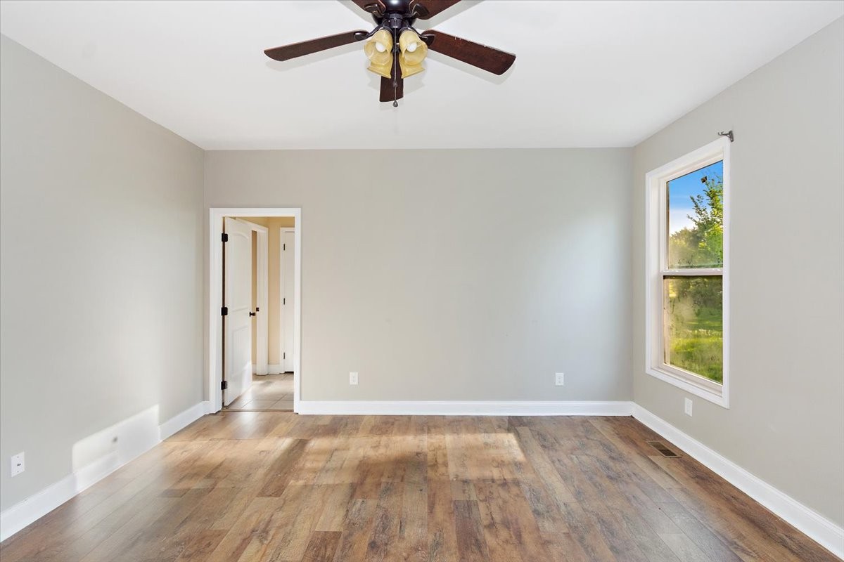 118 East Biggs Road Portland, TN 37148 - Photo 16 of 26 wooden floor in an empty room with a window