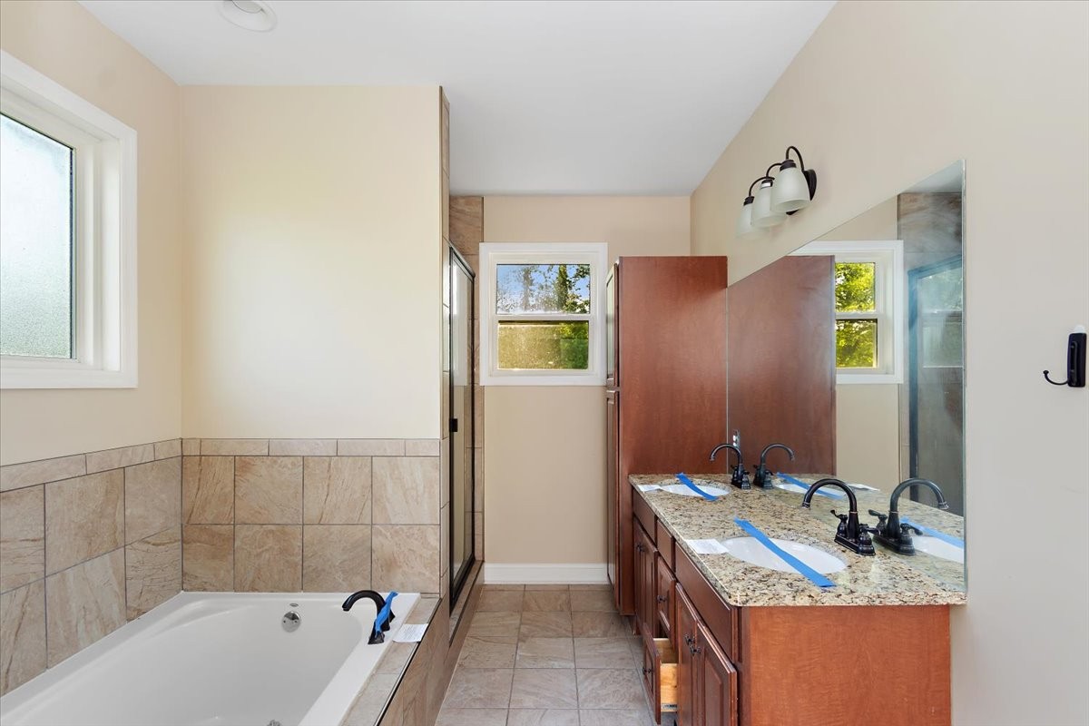 118 East Biggs Road Portland, TN 37148 - Photo 17 of 26 a bathroom with a tub sink and mirror