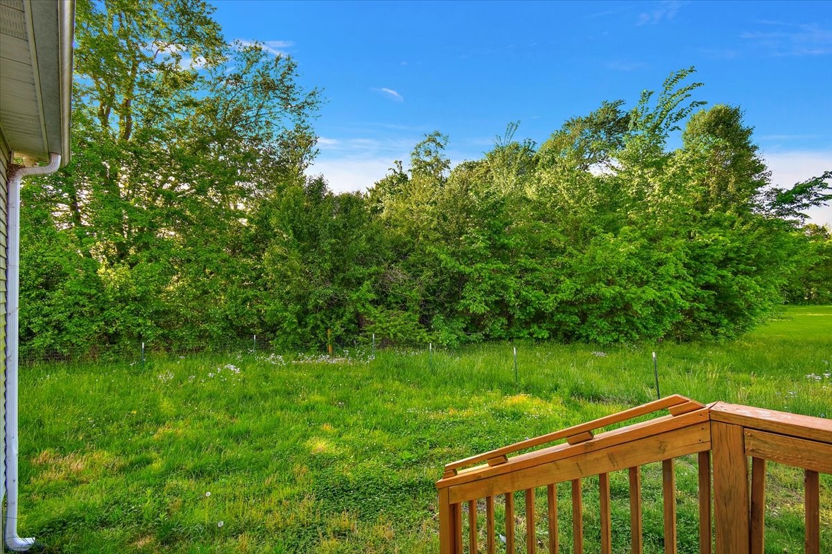 118 East Biggs Road Portland, TN 37148 - Photo 22 of 26 a view of a yard with a wooden fence