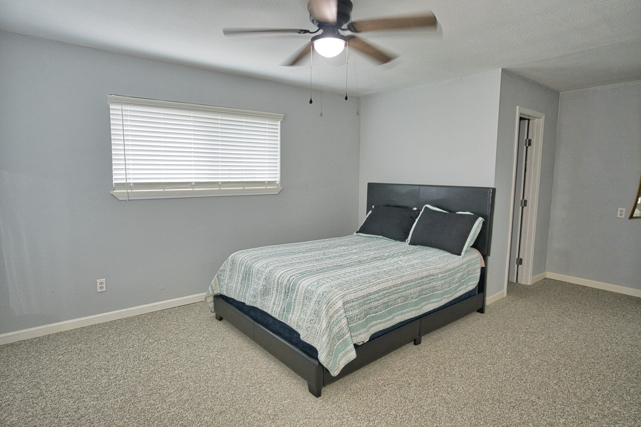 5401 County Road 334, Unit 10 Sweeny, TX 77480 - Photo 12 of 15 a bedroom with a bed and window