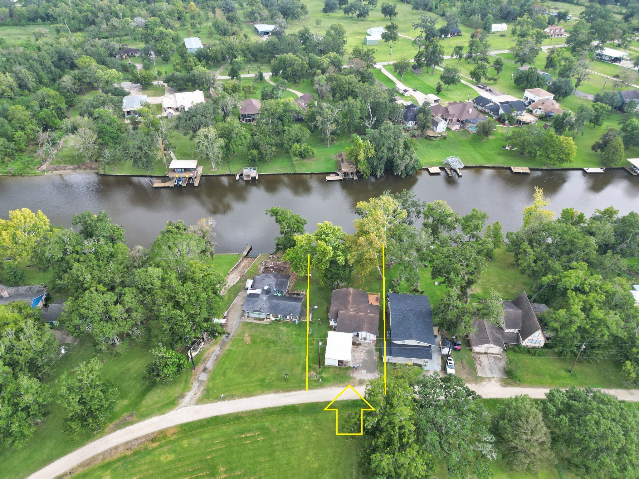 5401 County Road 334, Unit 10 Sweeny, TX 77480 - Photo 15 of 15 an aerial view of a house with a yard and lake view