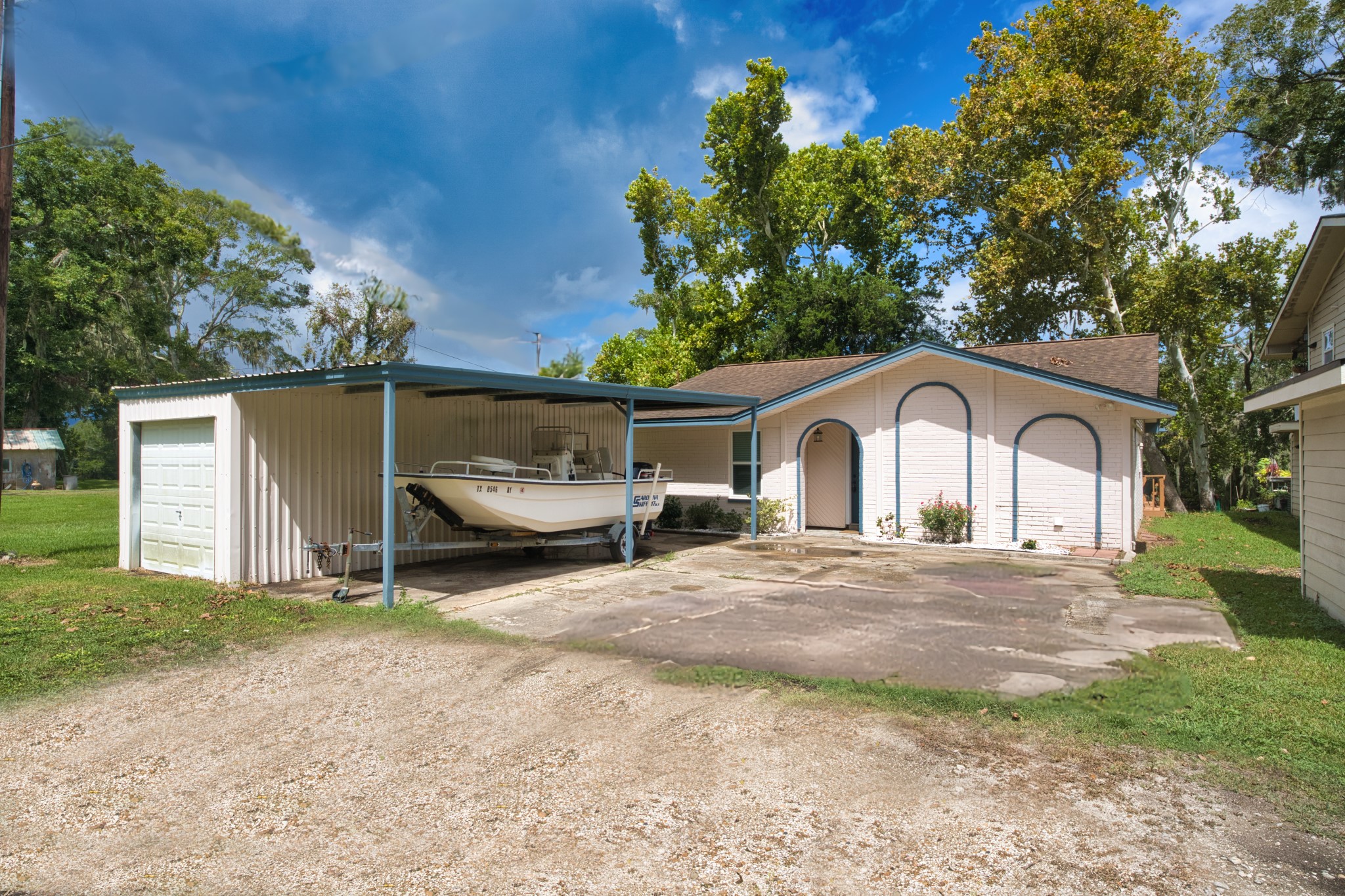 5401 County Road 334, Unit 10 Sweeny, TX 77480 - Photo 5 of 15 a front view of a house with a yard and garage